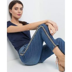Jeansy girlfriend z lampasami. Niebieskie jeansy damskie Orsay, s, bez wzorów, z elastanu, z podwyższonym stanem. W wyprzedaży za 95,00 zł.