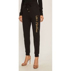 Love Moschino - Spodnie. Czarne spodnie damskie Love Moschino, s, z elastanu. W wyprzedaży za 499,90 zł.