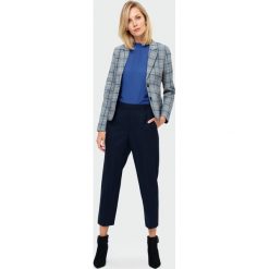 Elegancki żakiet w kratę - 40. Żakiety damskie e-margeritka.pl, do pracy, na zimę, bez wzorów, z elastanu, eleganckie, z klasycznym kołnierzykiem, z krótkim rękawem, krótkie, mini, ołówkowe. Za 129,99 zł.