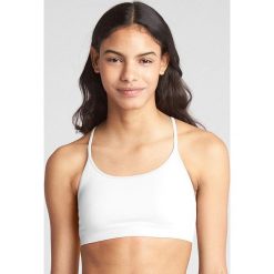 Top w kolorze białym. Białe topy damskie Gap Body, m, bez wzorów, z materiału. W wyprzedaży za 39,95 zł.