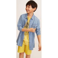 Mango Kids - Szorty dziecięce Pepe 110-164 cm. Żółte spodenki chłopięce Mango Kids, bez wzorów, z bawełny, casualowe. W wyprzedaży za 29,90 zł.