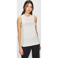 Under Armour - Top. Białe topy damskie marki Under Armour, s, z nadrukiem, z bawełny, z okrągłym kołnierzem. Za 89,90 zł.
