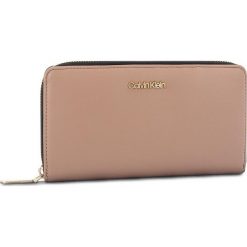 Duży Portfel Damski CALVIN KLEIN - Fold Large Zip Aroun K60K604491 007. Brązowe portfele damskie Calvin Klein, ze skóry ekologicznej. Za 299,00 zł.