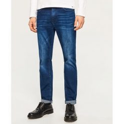 Jeansy slim fit - Granatowy. Niebieskie jeansy męskie relaxed fit marki Reserved. Za 169,99 zł.