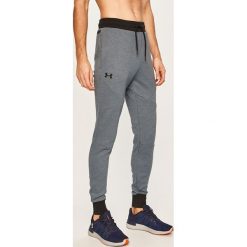 Under Armour - Spodnie. Niebieskie spodnie męskie Under Armour, xl, bez wzorów, z bawełny. W wyprzedaży za 199,90 zł.