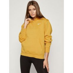 Bluza NIKE Essential Trend Hoodie BV4118. Żółte bluzy damskie Nike, s, bez wzorów, z bawełny, bez rękawów, bez kaptura. Za 229,00 zł.