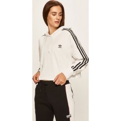 Adidas Originals - Bluza. Białe bluzy damskie adidas Originals, z aplikacjami, z bawełny, bez rękawów, z kapturem. W wyprzedaży za 159,90 zł.