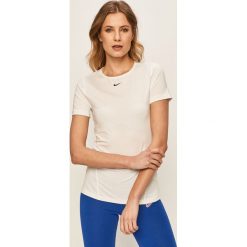 Nike - T-shirt. Różowe topy damskie Nike, s, bez wzorów, z elastanu, z okrągłym kołnierzem. Za 129,90 zł.