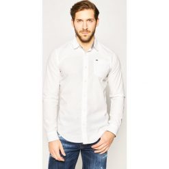 Koszula Tommy Jeans Original DM0DM04406. Białe koszule męskie Tommy Jeans, m, bez wzorów, z bawełny, casualowe, bez kołnierzyka, bez rękawów. W wyprzedaży za 169,00 zł.