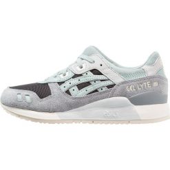 Asics Tiger GELLYTE III Tenisówki i Trampki black/blue surf. Czarne trampki i tenisówki damskie marki Asics Tiger, ze skóry. W wyprzedaży za 370,30 zł.