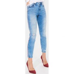 Jeansy skinny z lampasami - Niebieski. Niebieskie jeansy damskie Mohito. W wyprzedaży za 59,99 zł.