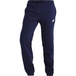 Nike Sportswear Spodnie treningowe obsidian/white. Niebieskie spodnie męskie marki Nike Sportswear, xl, bez wzorów, z bawełny. Za 379,00 zł.