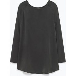 Jedwabna tunika w kolorze ciemnoszarym. Szare tuniki damskie American Vintage, m, bez wzorów, z jedwabiu, z okrągłym kołnierzem, bez rękawów. W wyprzedaży za 249,95 zł.