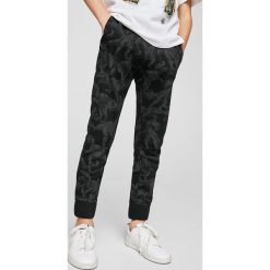 Spodnie męskie: Mango Kids – Spodnie dziecięce Fossil 104-164 cm