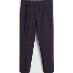 Mango Kids - Spodnie dziecięce Berry 110-164 cm. Niebieskie spodnie dziewczęce Mango Kids, bez wzorów, z elastanu. W wyprzedaży za 59,90 zł.