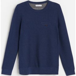 Sweter z bawełny organicznej -. Swetry męskie Reserved, bez wzorów, z bawełny, bez kołnierzyka, bez kaptura. Za 49,99 zł.
