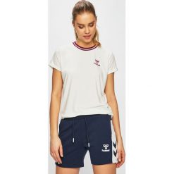 Hummel - Top sportowy. Białe topy damskie Hummel, s, bez wzorów, z elastanu, z krótkim rękawem. W wyprzedaży za 69,90 zł.