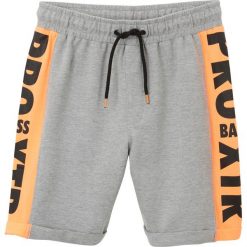 Bermudy dresowe chłopięce bonprix jasnoszary melanż + pomarańczowy. Szare dresy chłopięce bonprix, w paski, z bawełny. Za 42,99 zł.