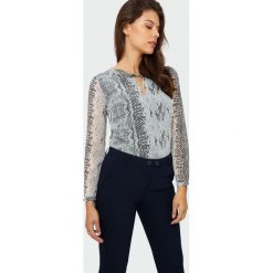 Elegancka bluzka z nadrukiem. Bluzki damskie Greenpoint, z nadrukiem, z poliesteru, eleganckie. Za 49,99 zł.