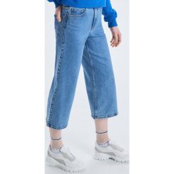 Jeansowe spodnie culotte - Niebieski. Niebieskie spodnie damskie Cropp, z jeansu. Za 89,99 zł.