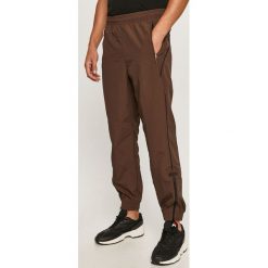 Adidas Originals - Spodnie. Pomarańczowe spodnie męskie adidas Originals, xl, bez wzorów, z poliesteru. Za 269,90 zł.
