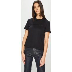 Calvin Klein Jeans - Top. Czarne topy damskie marki Calvin Klein Jeans, s, z aplikacjami, z bawełny, z okrągłym kołnierzem. Za 179,90 zł.
