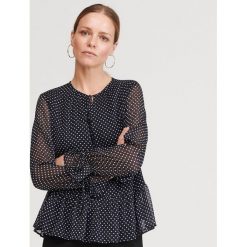 Bluzka w groszki - Czarny. Czarne bluzki damskie Reserved, w grochy, bez kołnierzyka, bez rękawów. Za 89,99 zł.