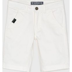 Guess Jeans - Szorty dziecięce 118-175 cm. Niebieskie spodenki chłopięce z aplikacjami, z elastanu, casualowe. W wyprzedaży za 129,90 zł.