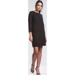 Czarna Sukienka Intend. Czarne sukienki damskie other, xl, bez wzorów, z okrągłym kołnierzem, bez rękawów, mini. Za 34,99 zł.