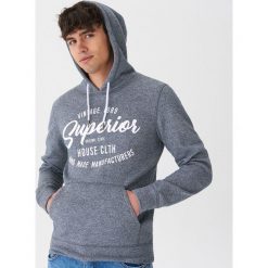 Bluza z kapturem Granatowy. Niebieskie bluzy męskie marki House, s, z kapturem. Za 119,99 zł.