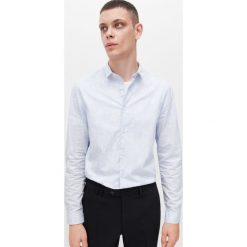 Wzorzysta koszula slim fit - Niebieski. Niebieskie koszule męskie Reserved, s, bez wzorów, bez kołnierzyka, bez rękawów. Za 109,99 zł.