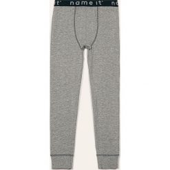 Name it - Spodnie piżamowe dziecięce 128-164 cm. Niebieskie piżamy chłopięce Name it, bez wzorów, z elastanu. Za 39,90 zł.