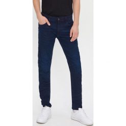 Jeansy slim fit - Granatowy. Niebieskie jeansy męskie House, bez wzorów. Za 99,99 zł.