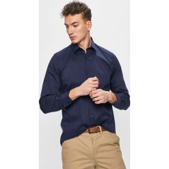Pierre Cardin - Koszula. Niebieskie koszule męskie Pierre Cardin, bez wzorów, z elastanu, klasyczne, z klasycznym kołnierzykiem, z długim rękawem. Za 299,90 zł.